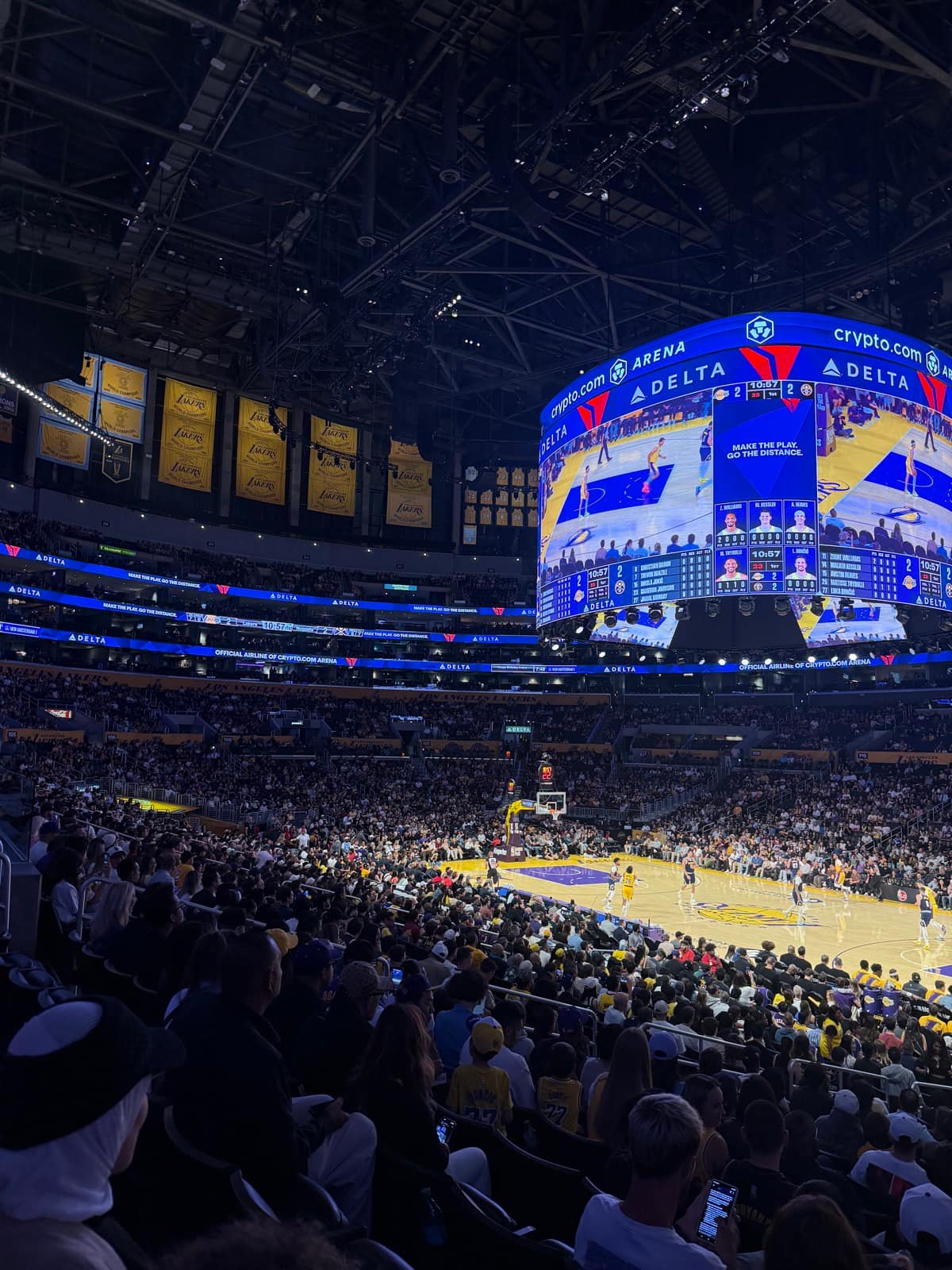 Lakers championship banners over the floor as the Nuggets bring it up in navy